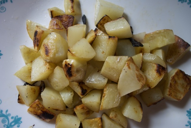 fried potatoes and onions on a plate