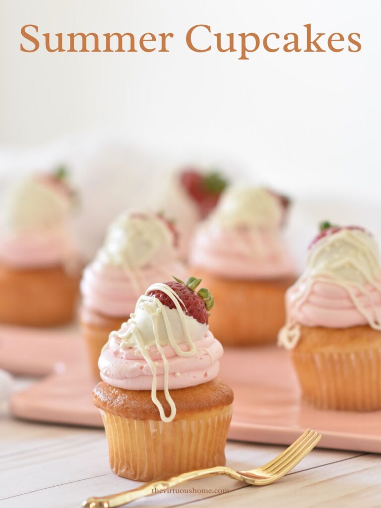 Summer Cupcakes with pink  icing and strawberries